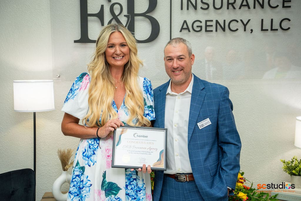 E&B Insurance owners receiving the Chamber of Commerce certificate